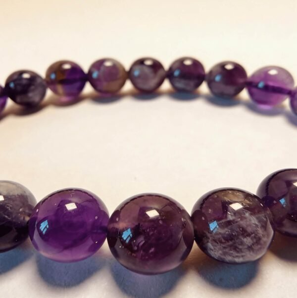 Close-up of natural amethyst bracelet beads