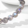 Close detail of gray moonstone beads with blue-flash appearance