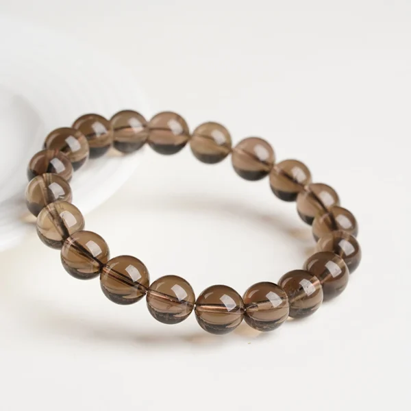 Angled view of a smoky brown quartz bead bracelet