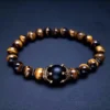 Tiger Eye and amethyst bead bracelet on dark background